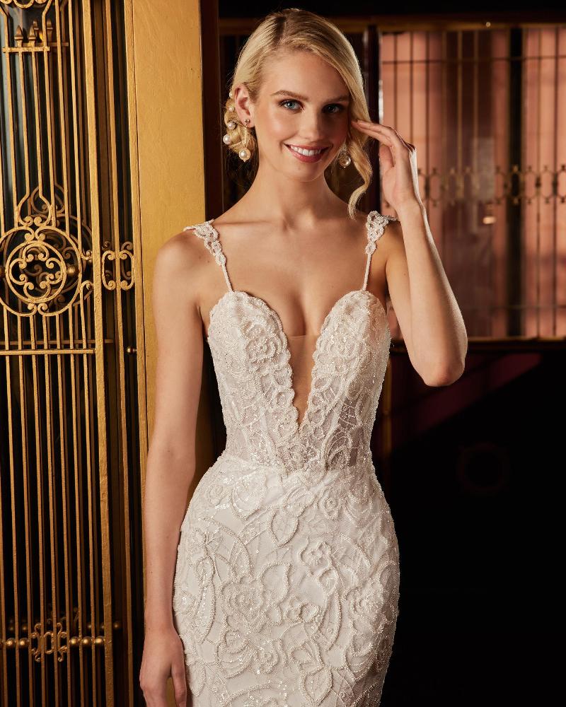 122109 fitted sparkly wedding dress with sleeves and plunging neckline4